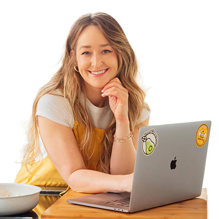 Lillie and Ross together with a chopping block and some vegetables.